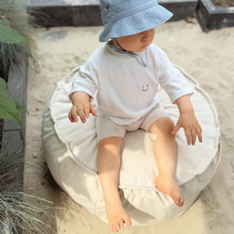 Coussin de sol rond d'extérieur en toile déperlante et résistante aux UV Outzy